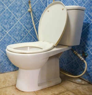 How to cut peel and stick tile around toilet