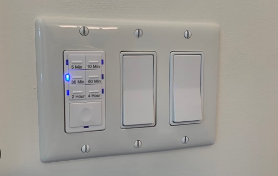 Can a fan isolator switch be in the bathroom
